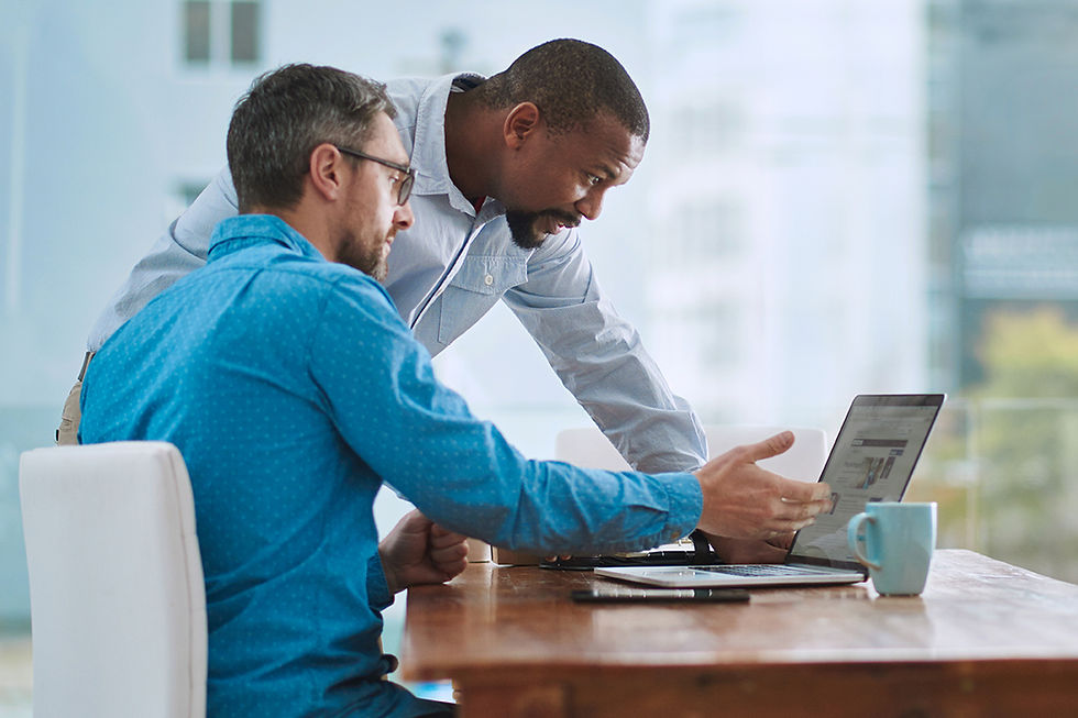Two professionals discussing business insurance and wealth strategies