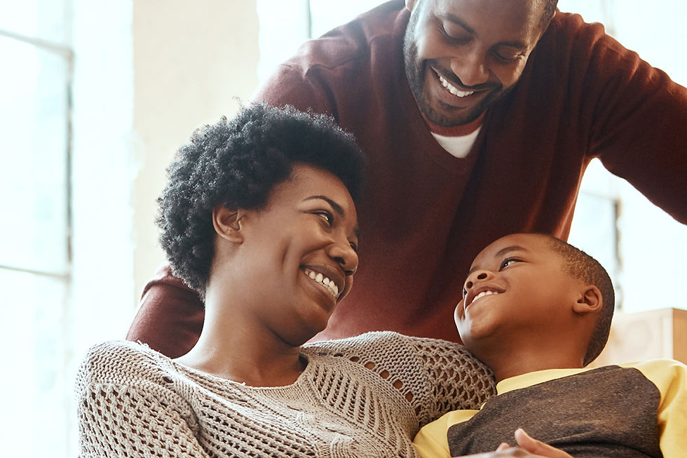 Happy family smiling together at home