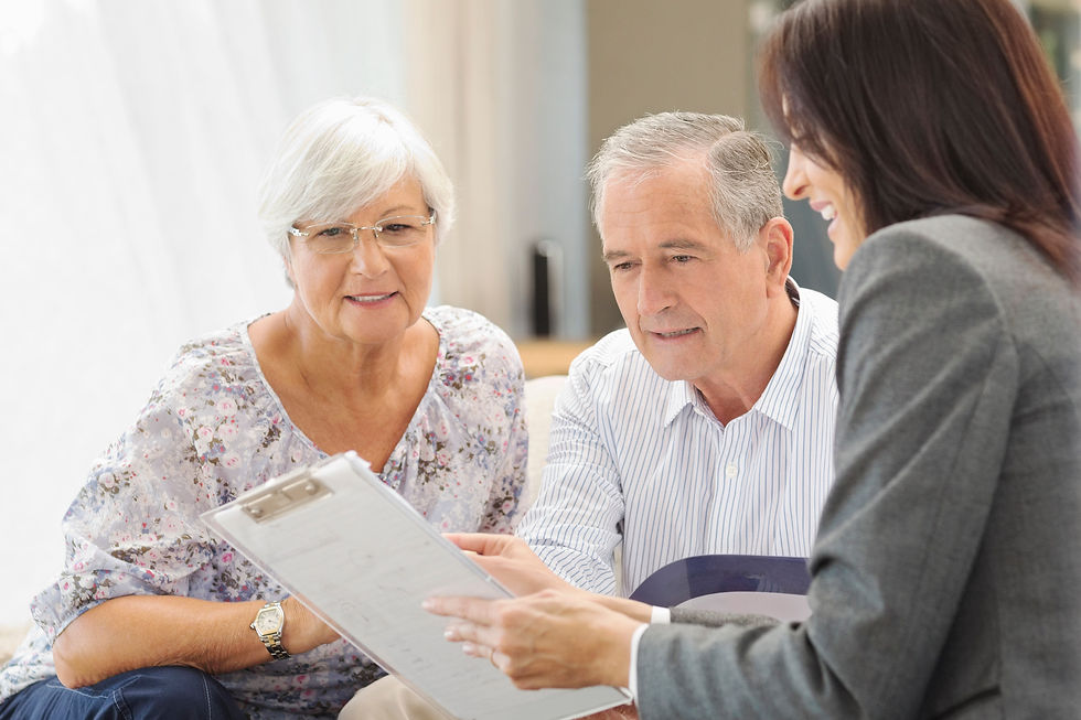 Senior couple reviewing life settlement strategy documents with advisor